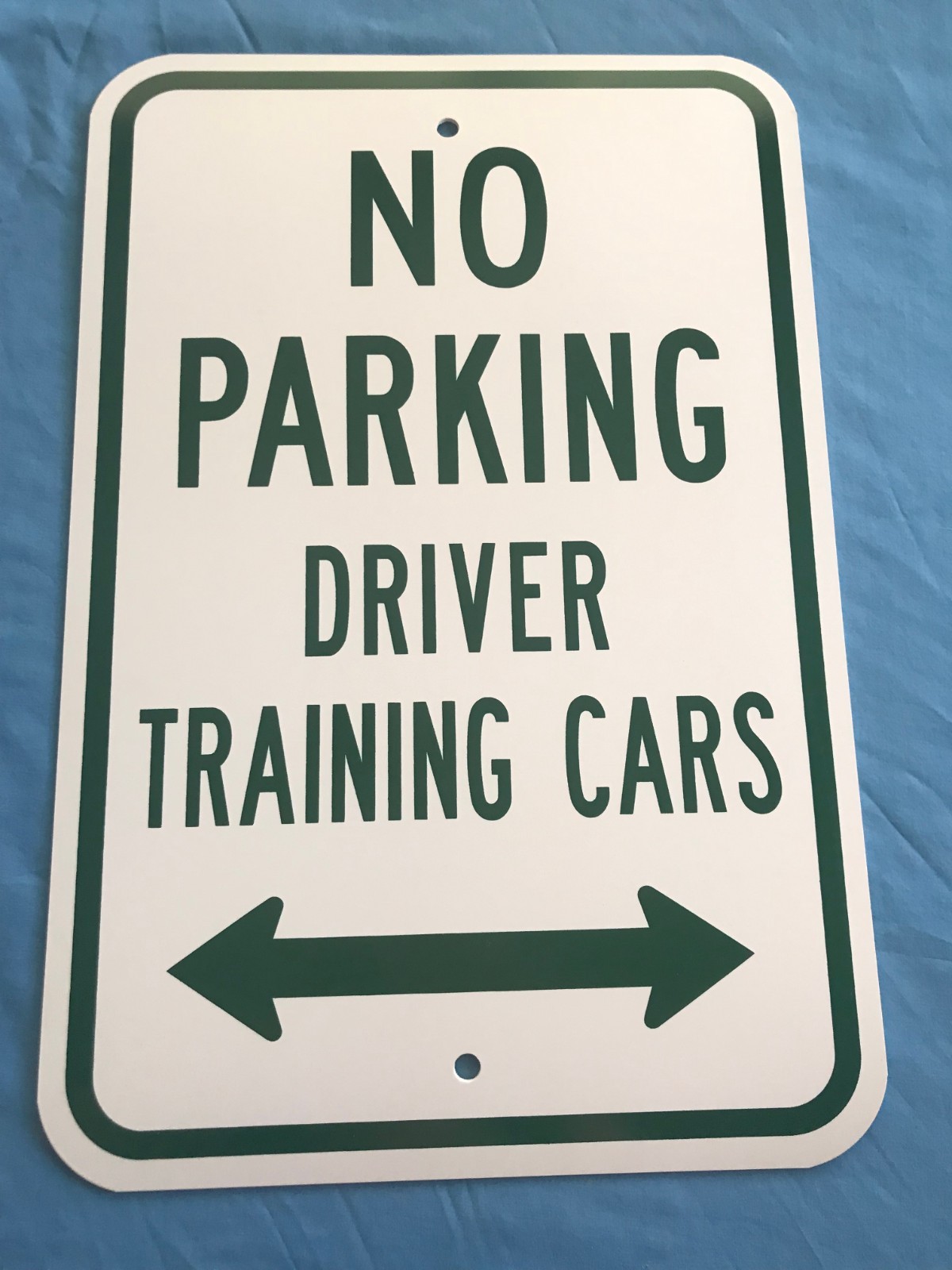 18”x12” White Plastic w/ Green Lettering “No Parking Driver Training Cars” Sign