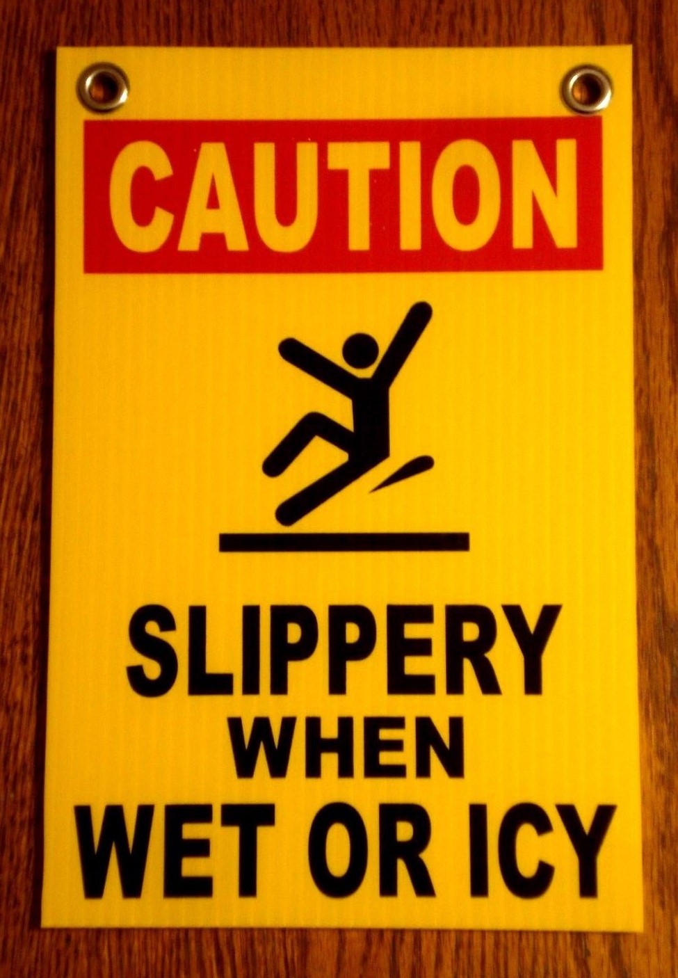 CAUTION -SLIPPERY WHEN WET OR ICY 8″ x12″ Plastic Coroplast Sign w/Grommets y
