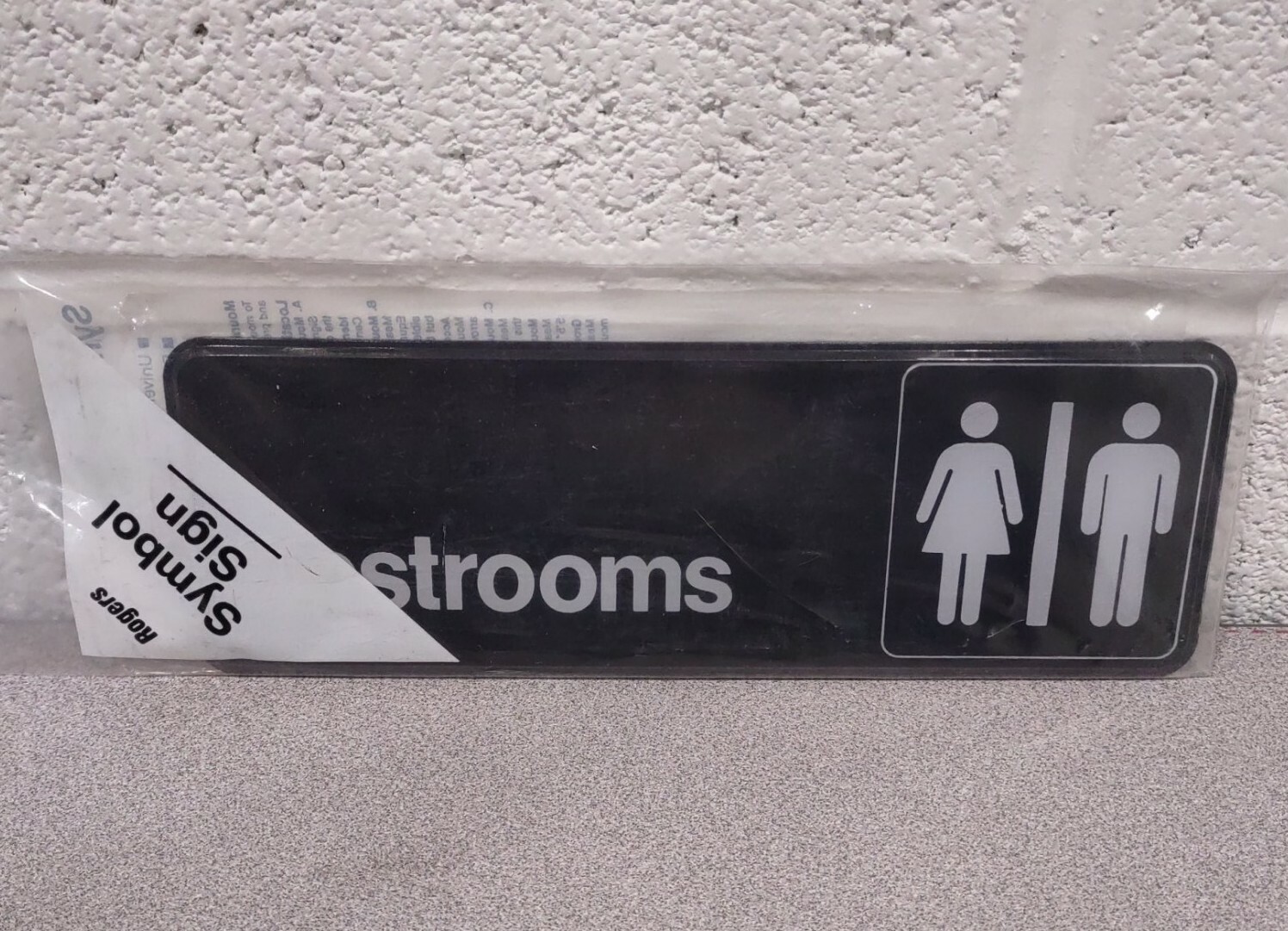 Unisex Restroom Sign Black Facing with White Detailing 9″x3″ UPC 20517