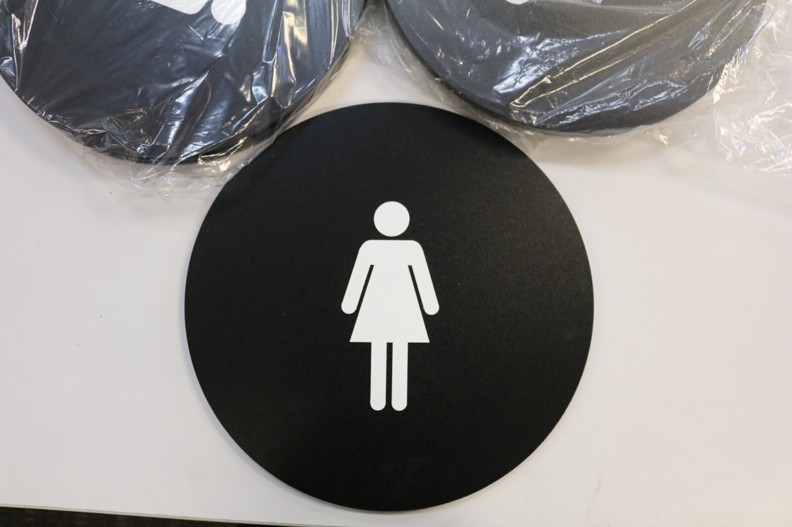 ADA Compliant Women’s Restroom Door Sign, 12″ Round/Triangle (Black)