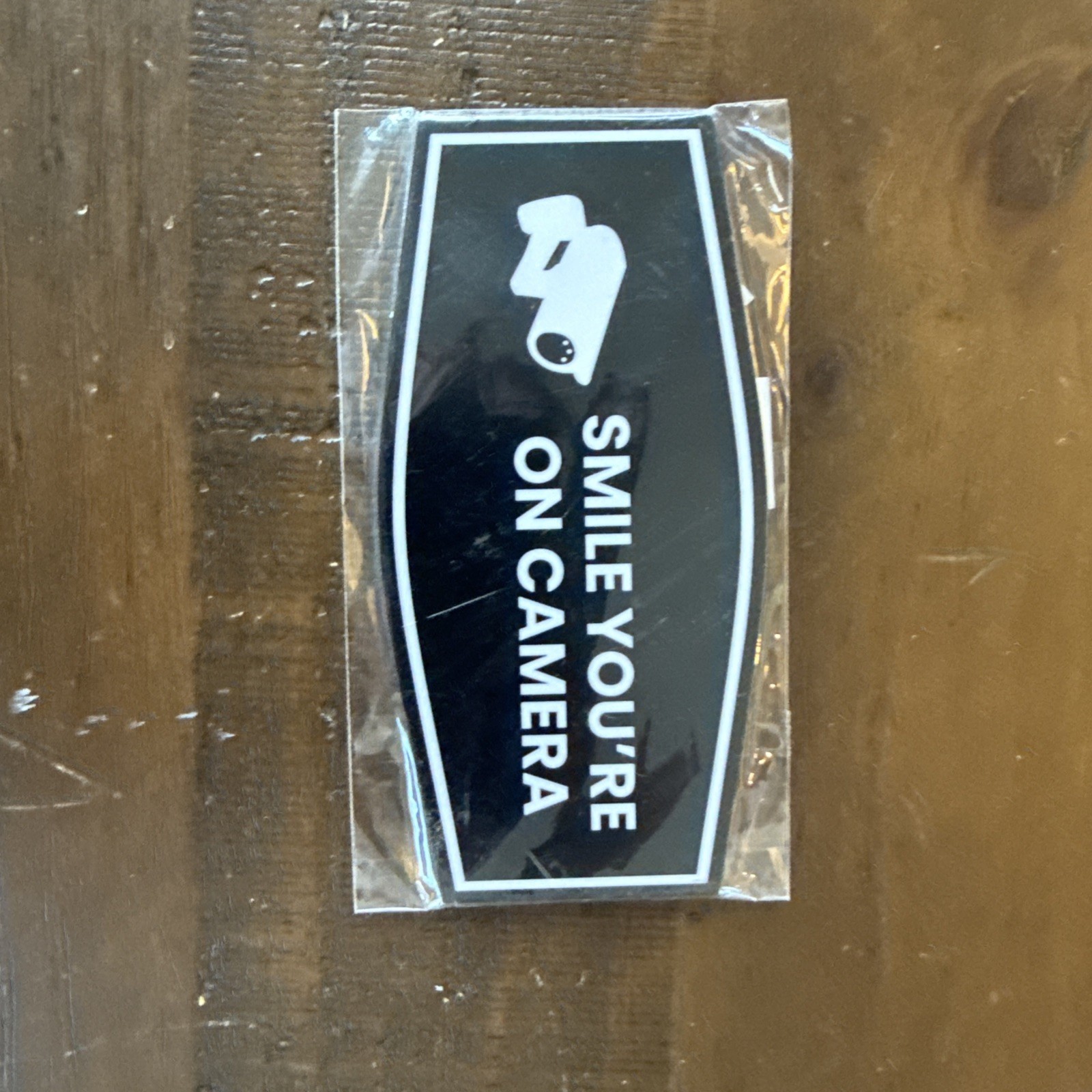2 Pack Fancy Smile You’re On Camera Wall or Door Sign Black 3″ X 6″
