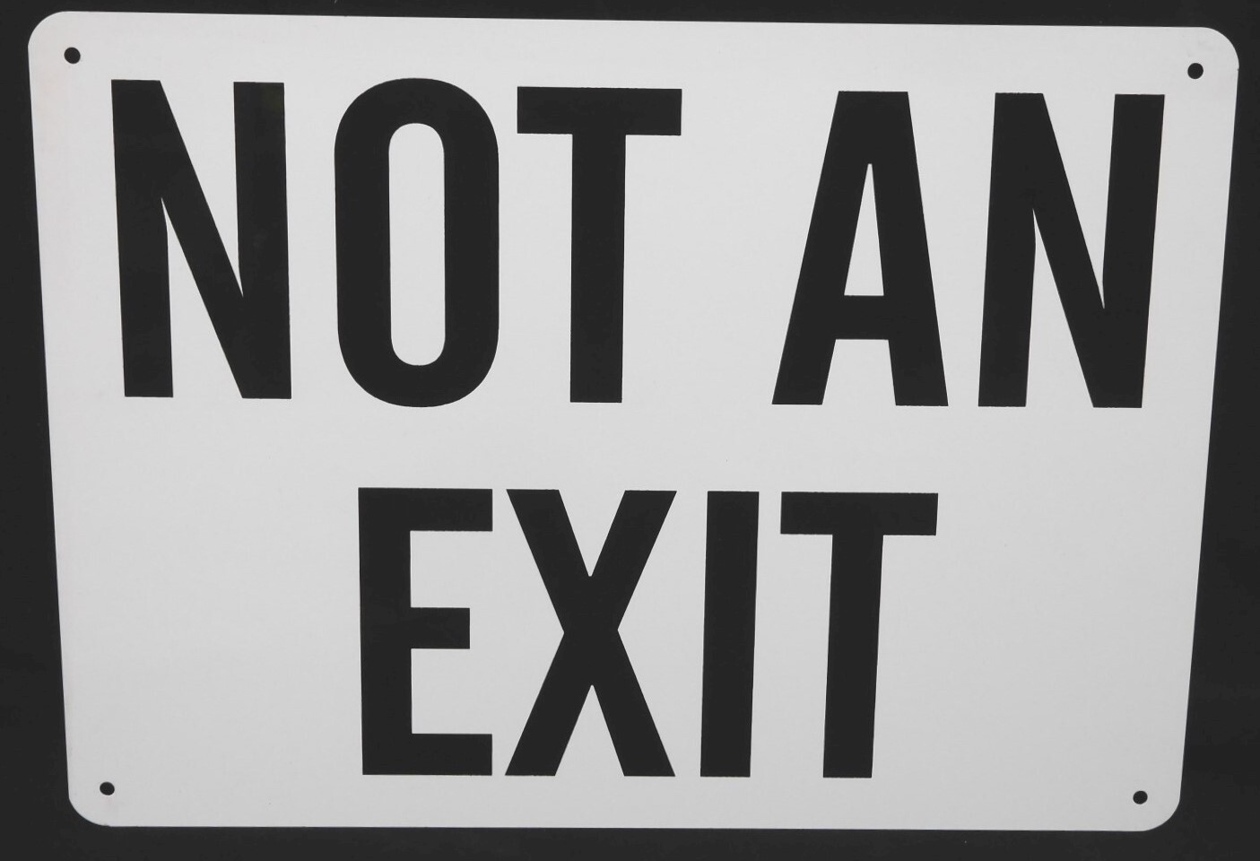 METAL PAINTED SIGN – READS: “NOT AN EXIT” – 14″ x 10″ WHITE WITH BLACK LETTERS