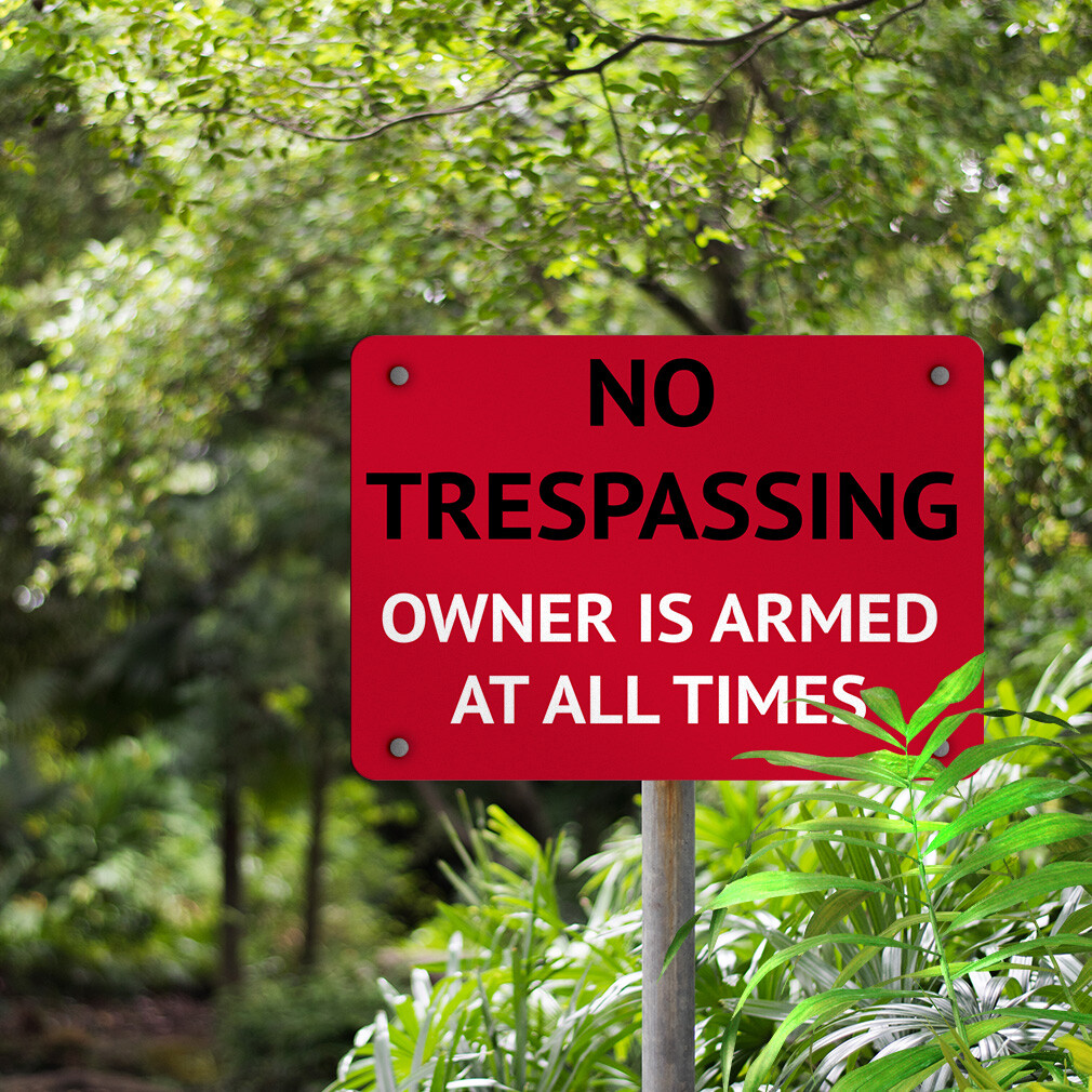 Horizontal Metal Sign No Trespassing Owner Is Armed at All Times Security