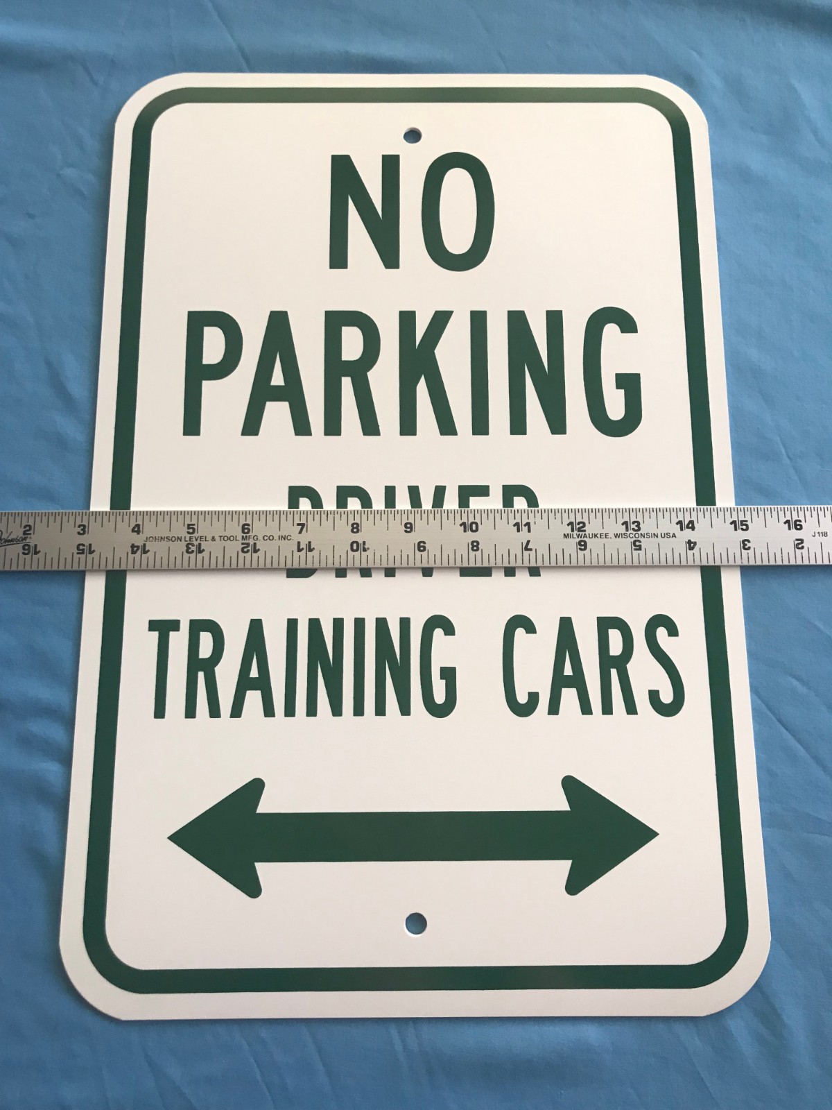 18”x12” White Plastic w/ Green Lettering “No Parking Driver Training Cars” Sign